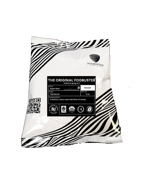 A white and black striped bag of The Original FogbusterⓇ by Fogbuster® Coffee Works, featuring its stout roast, cupping notes, 3oz weight, and a QR code on the front.