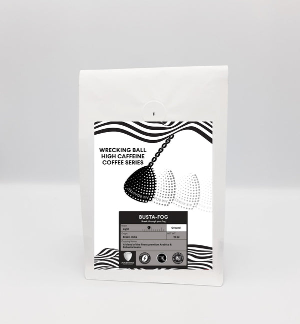 A white coffee bag from Fogbuster® Coffee Works labeled "Wrecking Ball," features a black wrecking ball illustration, strength scale, and wavy black lines. Crafted with Robusta beans for high caffeine Busta-Fog ground coffee.