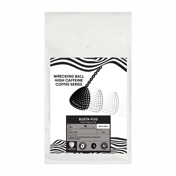 A white bag of "Wrecking Ball" by Fogbuster® Coffee Works features a wrecking ball illustration, details on the "Busta-Fog" blend with robusta beans for extra caffeine, plus roast info and bean origin.