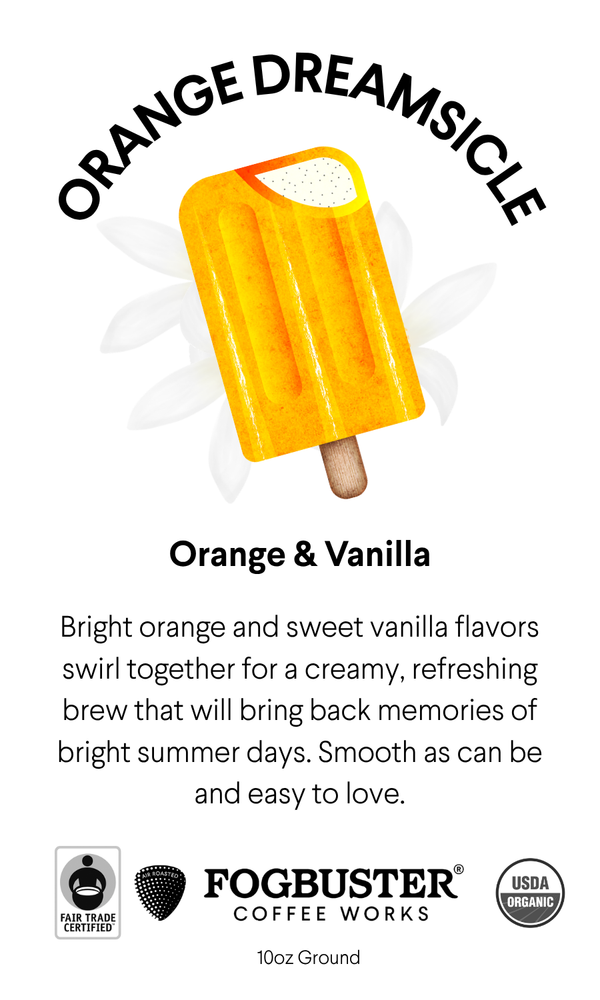 An orange and vanilla popsicle on white with "Orange Dreamsicle" light roast coffee by Fogbuster® Coffee Works, plus Fair Trade and USDA Organic logos.