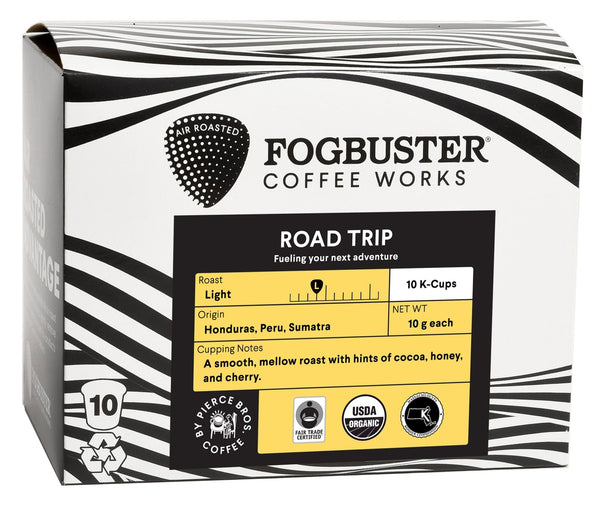 A box of Fogbuster® Coffee Works "Air-Roasted - Single Serve K-Cups (Gourmet - Low Acid - Single Serve Coffee)" features a light roast sourced from Honduras, Peru, and Sumatra. Cupping notes highlight a smooth, mellow profile with hints of cocoa, honey, and cherry. It carries USDA Organic and Fair Trade Certified designations.