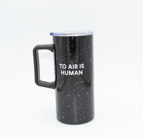 Metal Travel Mug, With a Clear plastic lid, Black With White flecks, and the Fogbuster® Coffee works logo and the words, To Air Is Human®